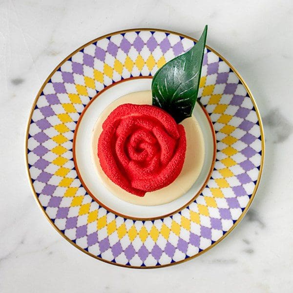 pastry artistic red rose on plate