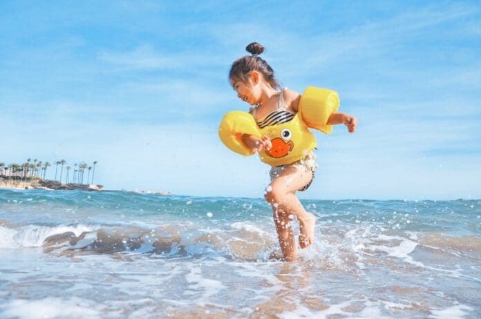 little girl playing at the beach