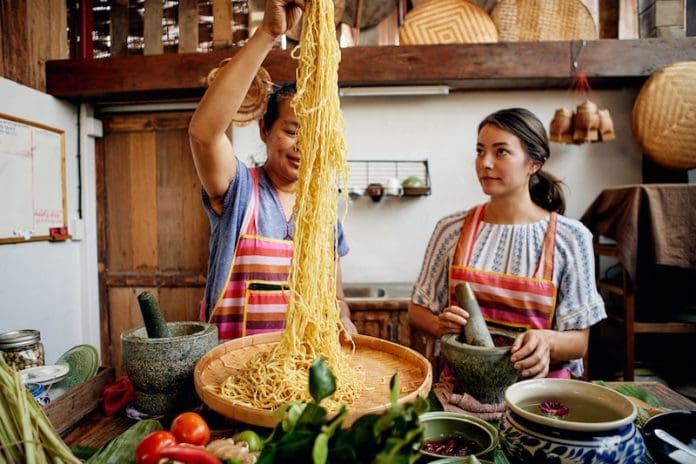 airbnb virtual cooking classes online pasta noodles women cooking noodles
