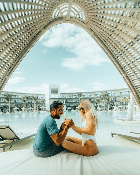 Haven resorts cancun couple resting laughing by the pool serenity club