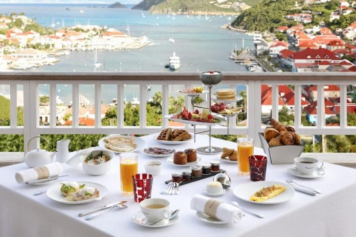 breakfast white tablecloth overlooking water in st. barth - East End Taste Magazine