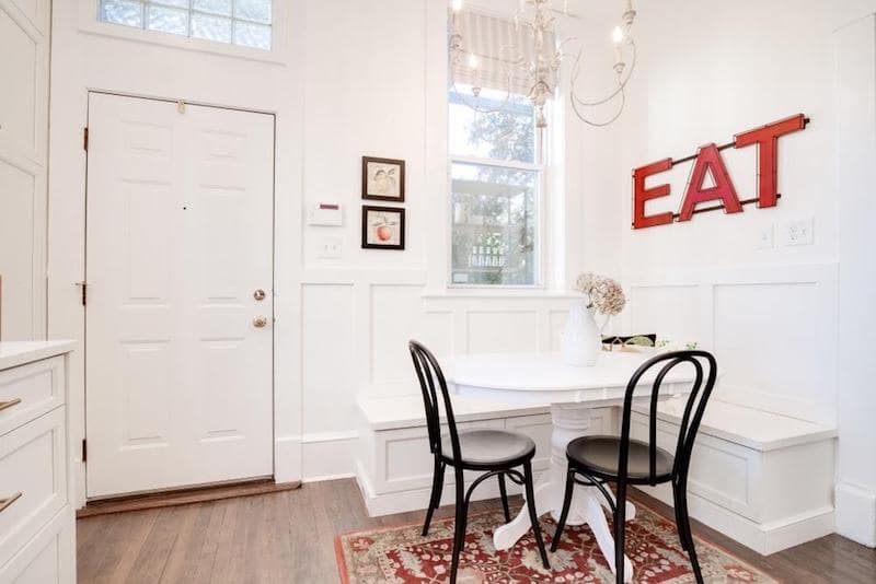 retro white kitchen with table eat sign