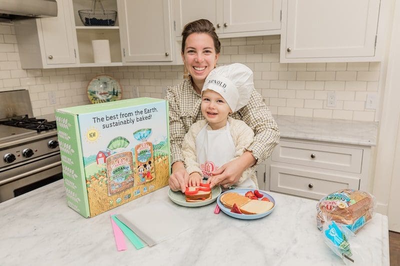 mom and son making mickey house sandwiches in kitchen