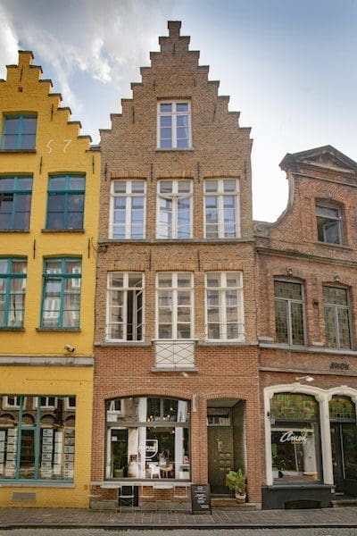 bruges belgium cafes and pubs blue sky