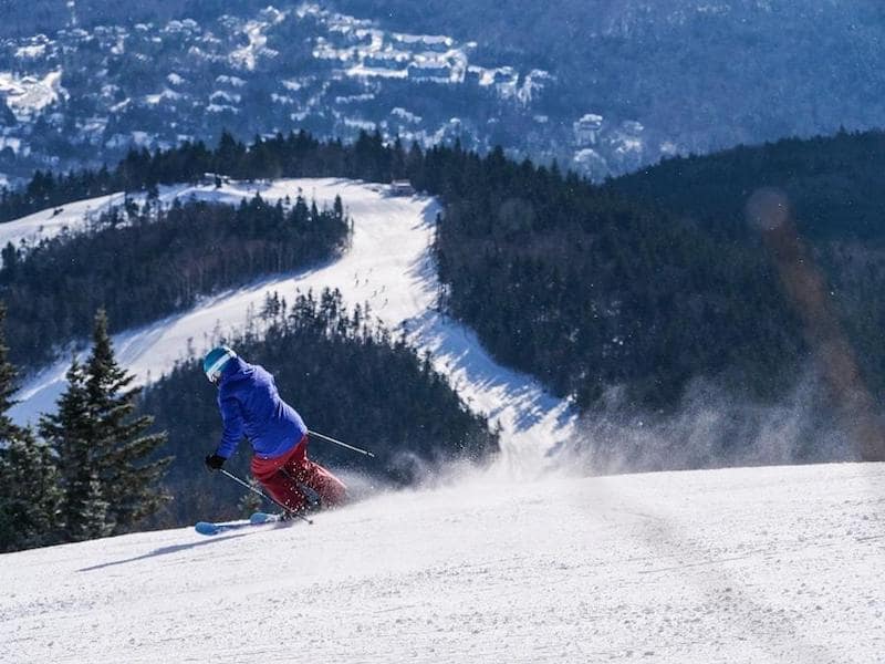 woman skiing downhill fast mountains ski winter