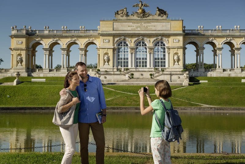 schoenbrunn family taking photo blue sky summer