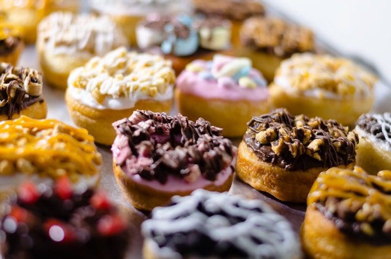 variety of doughnuts with toppings