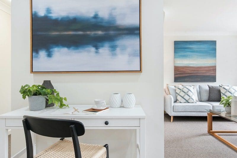 modern living room and desk with artwork