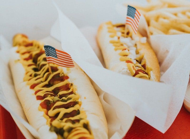 hot dogs with tiny american flags fourth of july celebration bbq
