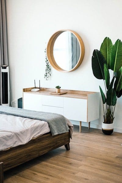 round mirror bedroom luxury decor white wall green plant