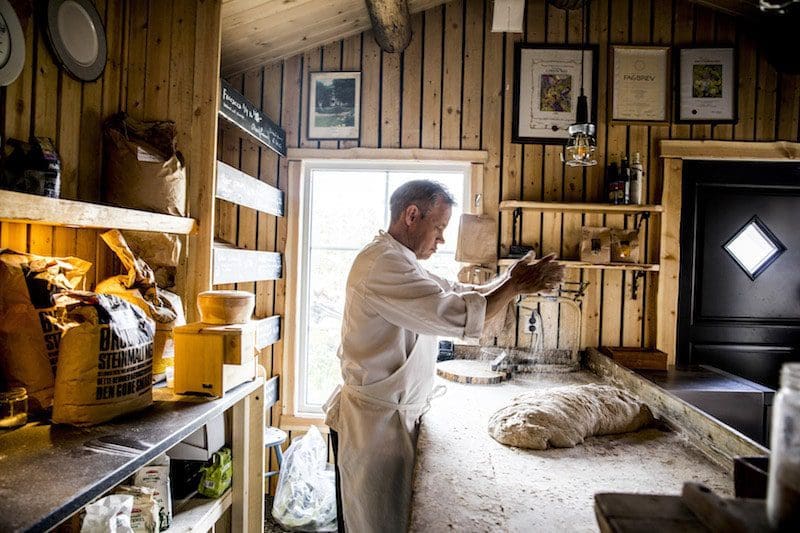 chef cooking in kitchen sustainable norway travel