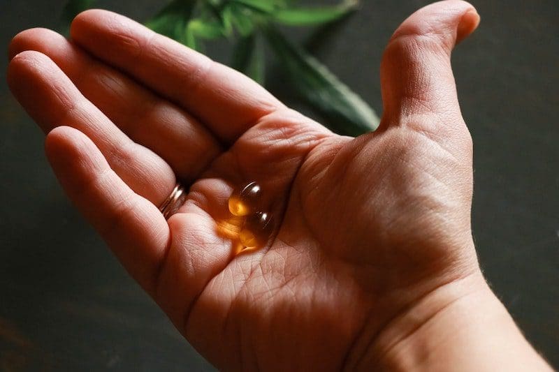cbd capsule in hand wellness hemp capsule