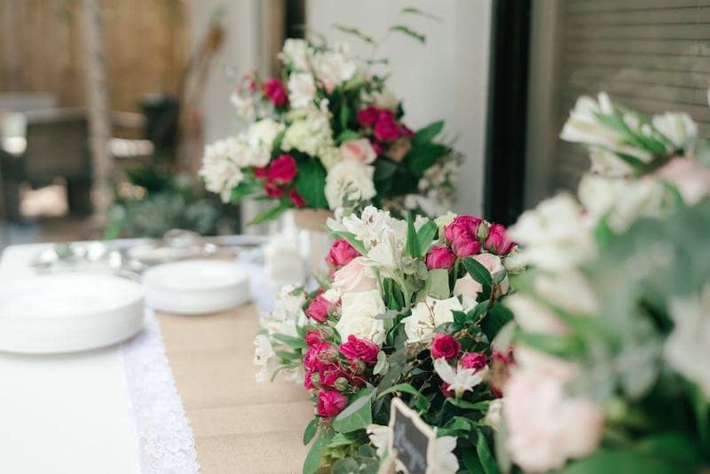 beautiful red green white floral arrangements wedding sentimental table