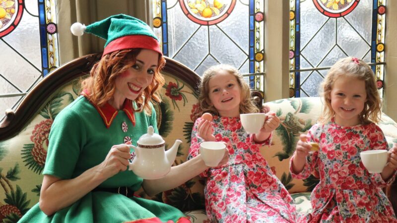elves and young girls enjoying afternoon tea festive fun
