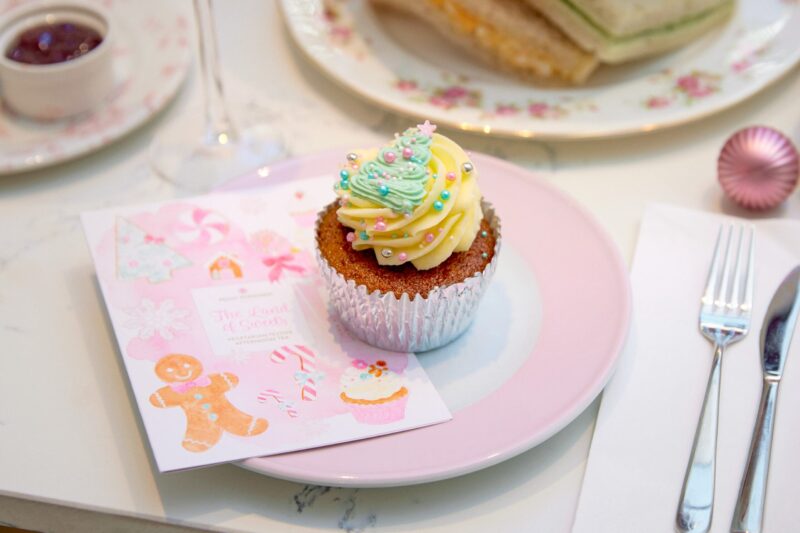 up close photo of a festive christmas cupcake pink plate