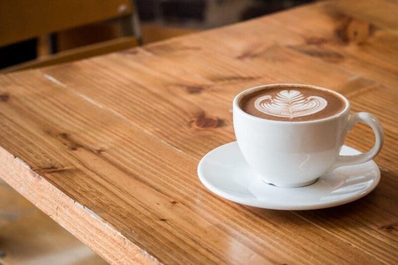 cafe latte art on wooden table