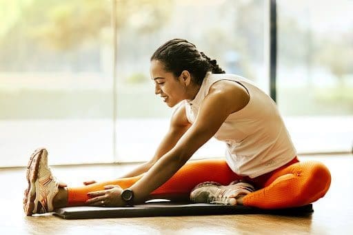 woman stretching and exercising