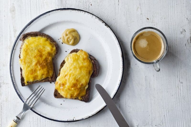 Close up of english pub grub welsh rarebit cheese sauce toast