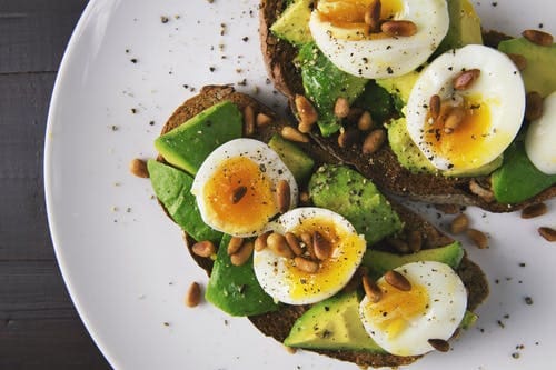 avocado toast and soft boiled eggs pine nuts
