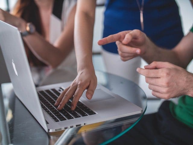 group of students working together at computer