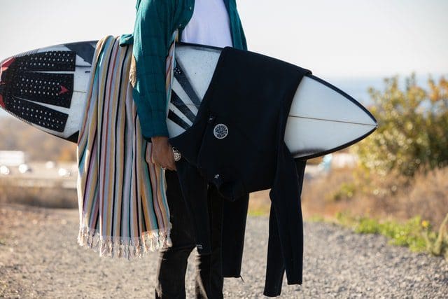 Wetsuit draped over a surfboard