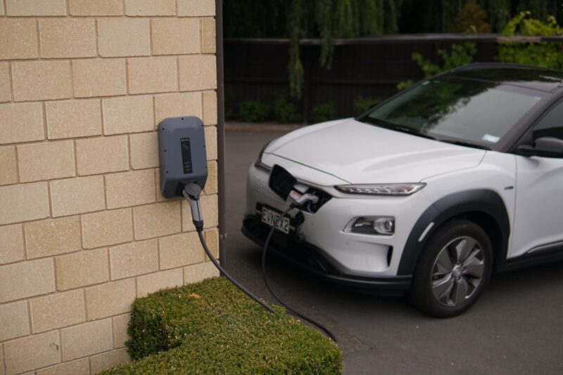 white electric vehicle on parking lot