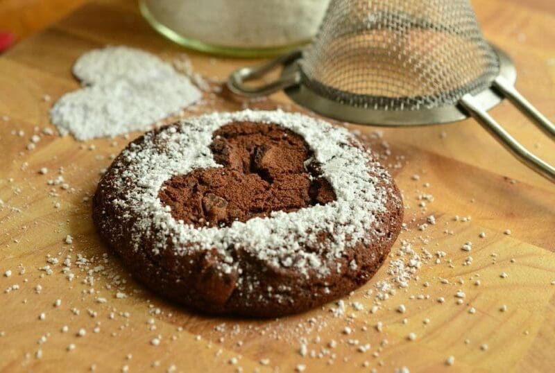 chocolate cookie with heart powdered sugar