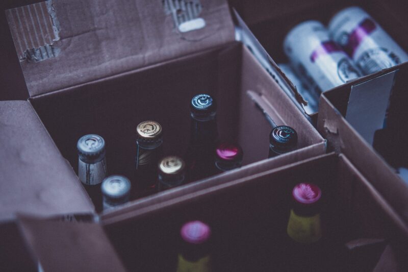 container of beer with bottle caps color