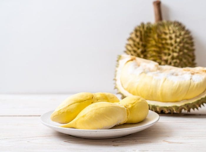 Fresh Durian Fruit on wood background