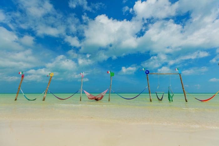Relaxing in a hammock over the water, Isla Holbox, Mexico