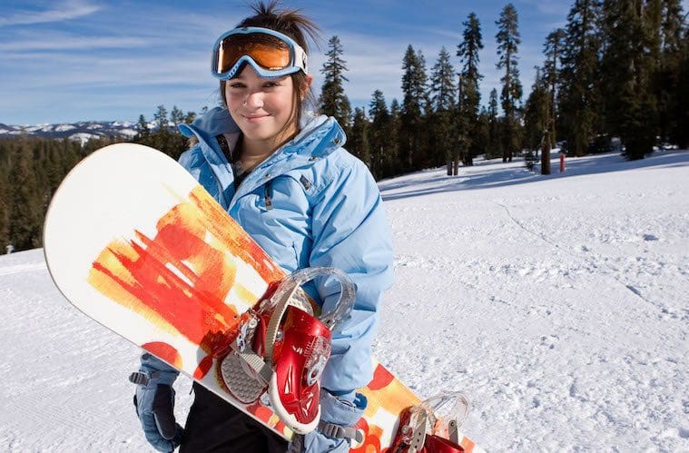 Tenaya at Yosemite female skier on slopes snow board