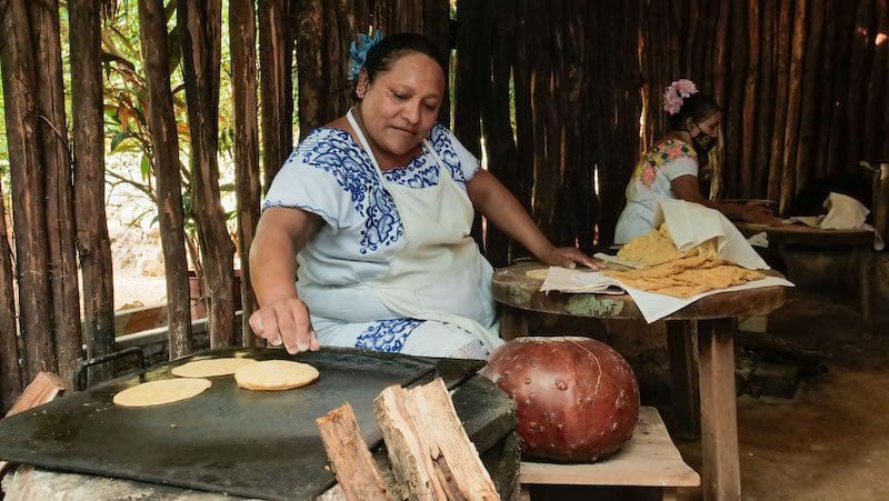 Mayan woman making homemade tortillas