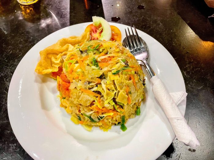 rice dish on white plate at restaurant