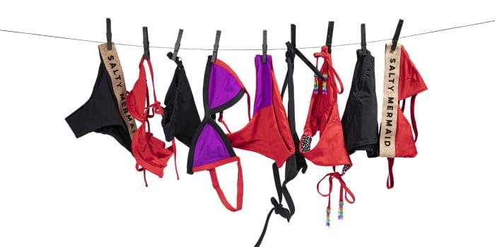 Salty Mermaid bathing suits hanging on clothesline