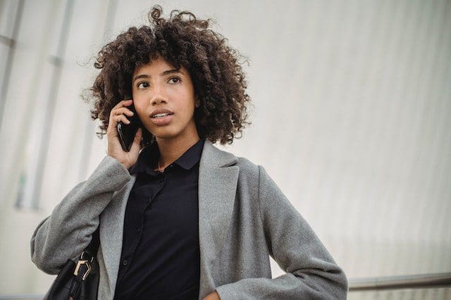Attractive black woman speaking on mobile phone