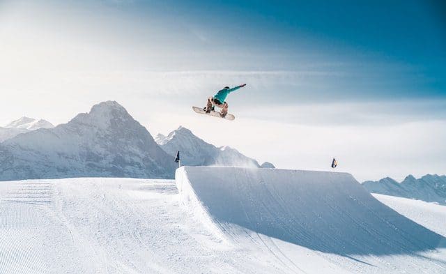 snowboarding tricks up slope in air
