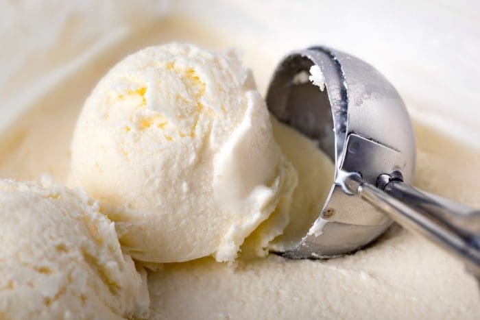 Creamy vanilla ice cream in a white cup