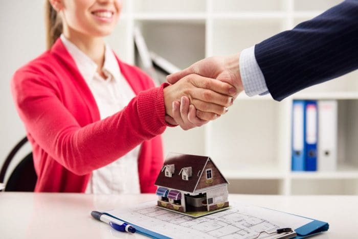 real estate transaction shaking hands