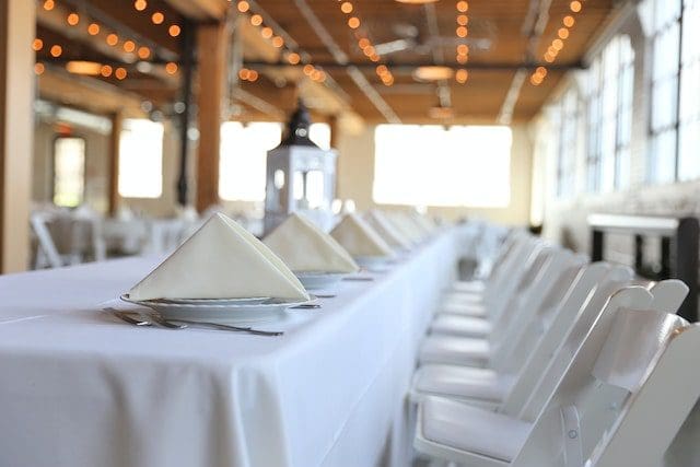 white tablecloth and ivory napkins party event table