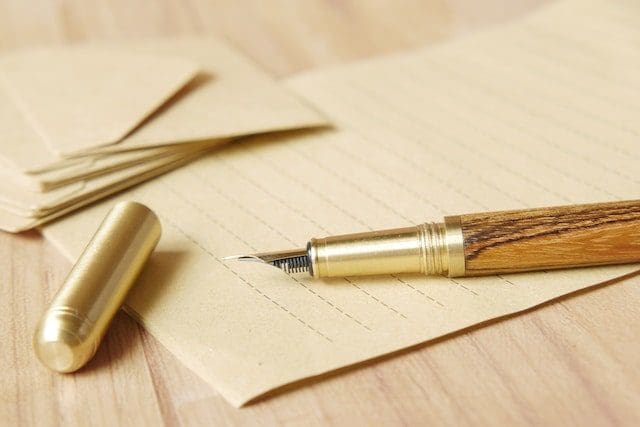 old fashioned pen and paper beige