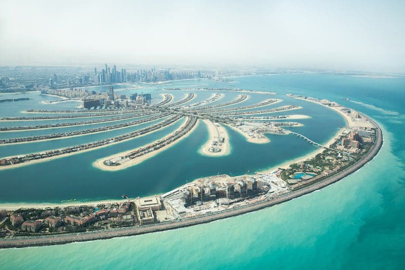 Aerial view of Palm Jumeirah man made island and Dubai Marina