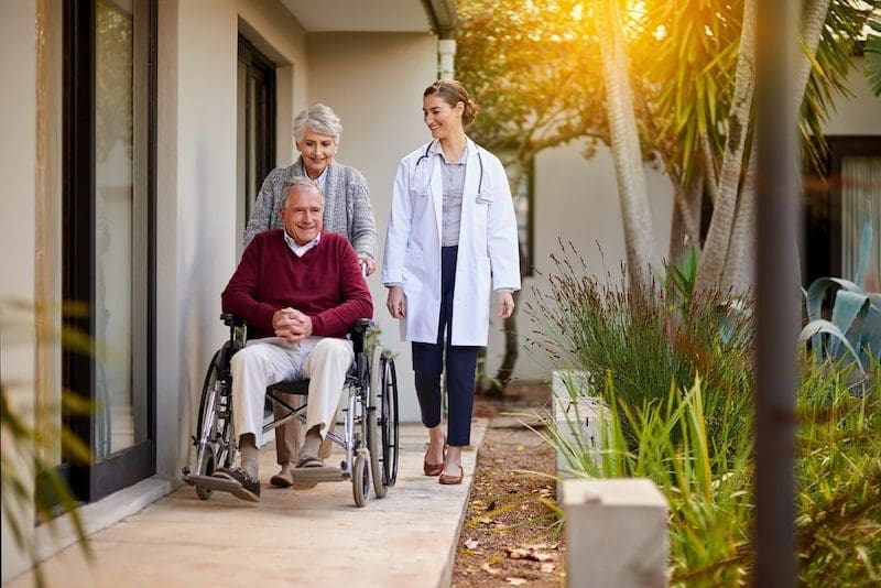 Hes eager to go home. Shot of a senior couple and doctor outside