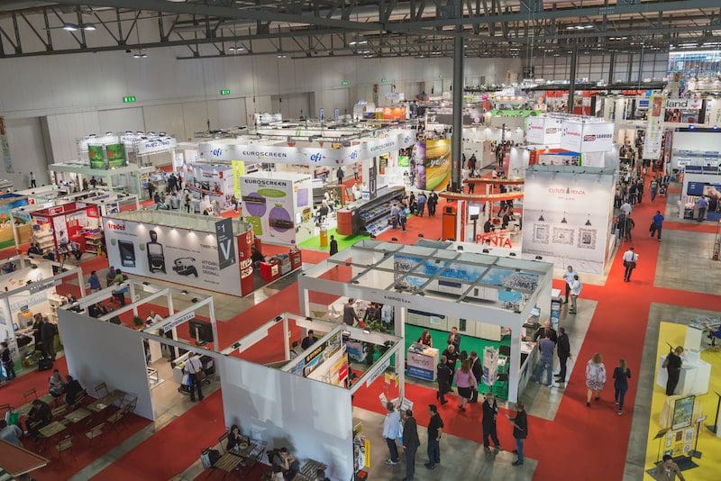 Top view of people and booths at Viscom trade fair in Milan