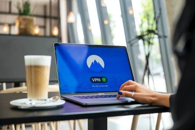person using black laptop signing in VPN