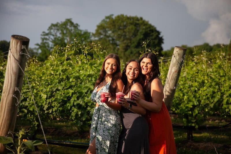 Del Vino Vineyards women standing with wine slushies