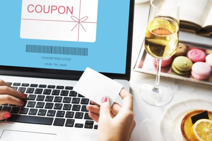coupon online shopping laptop with white wine macarons