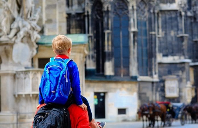 Father and son travel in the city of Vienna, Austria