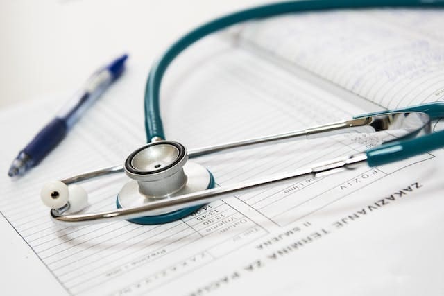 Stethoscope and pen white background