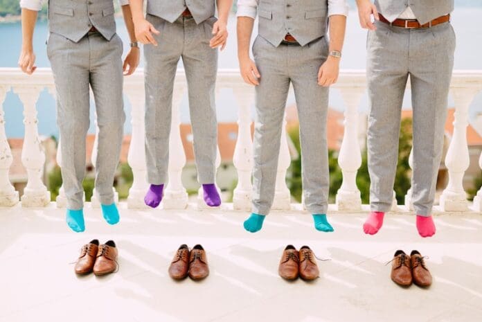 Men in colorful socks. Funny wedding photos