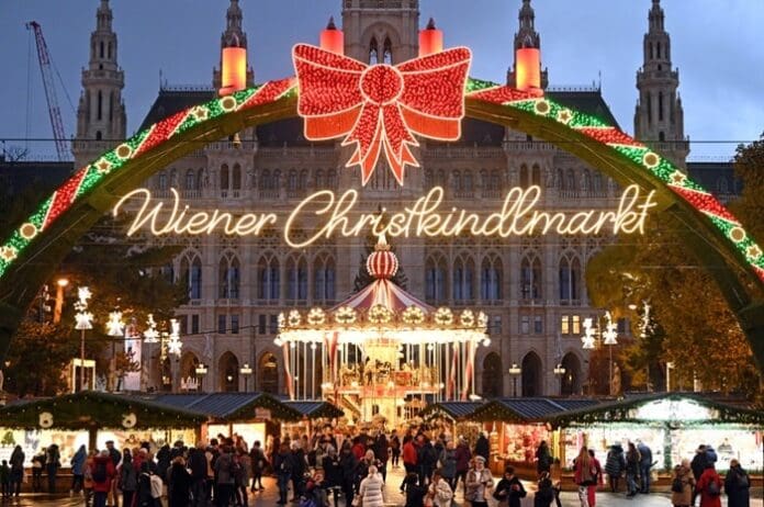 View of the illuminated Christmas market in front of the City